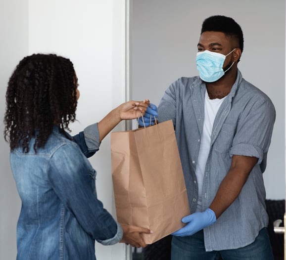 Masked african americans delivering goods cropped